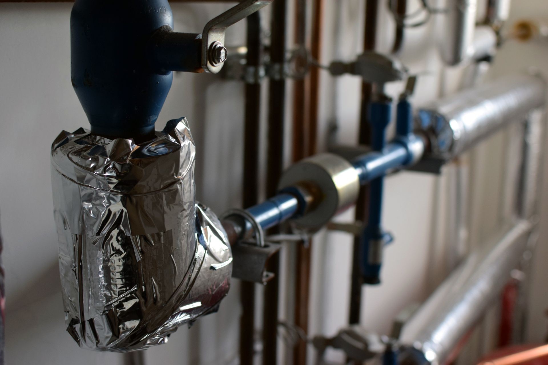 Close up of pipes in heating system. Horizontal image, focus on foreground.